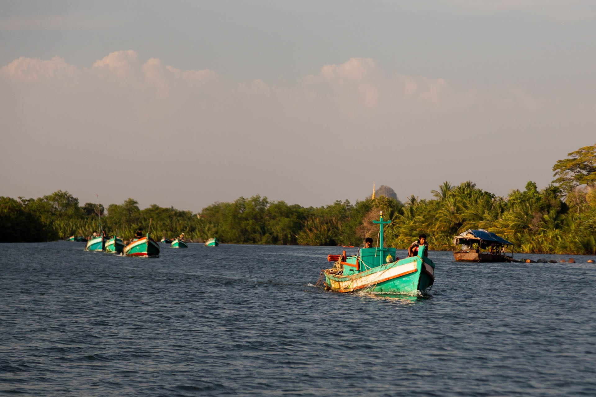 Traditional boat trip along the river at Kampot.
